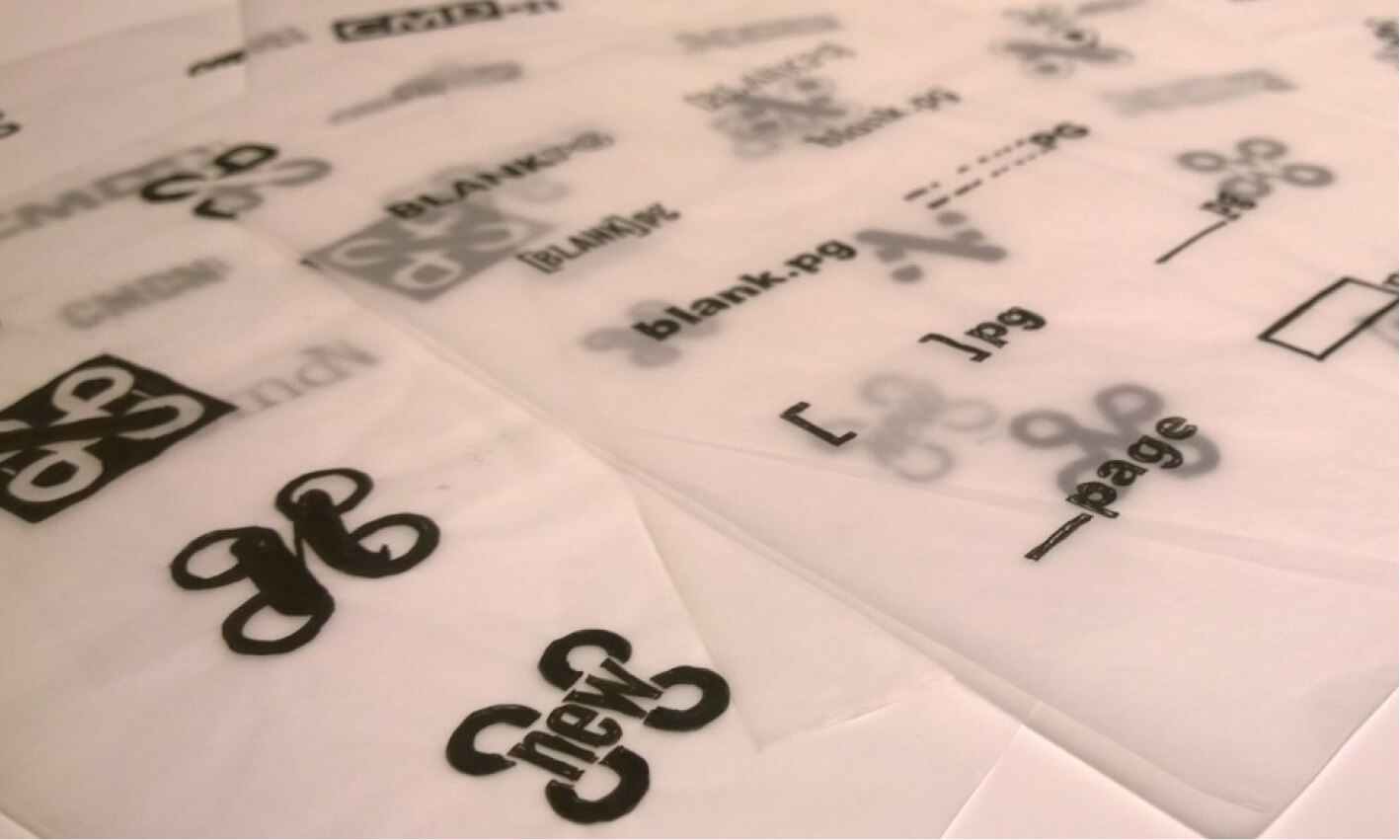 Logo sketches on transparent paper